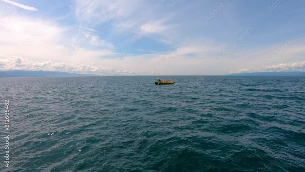 View Of Lone Boat In Middle Of Ocean. Slow Motion View Of Lone Boat In Middle Of Ocean. Slow Motion