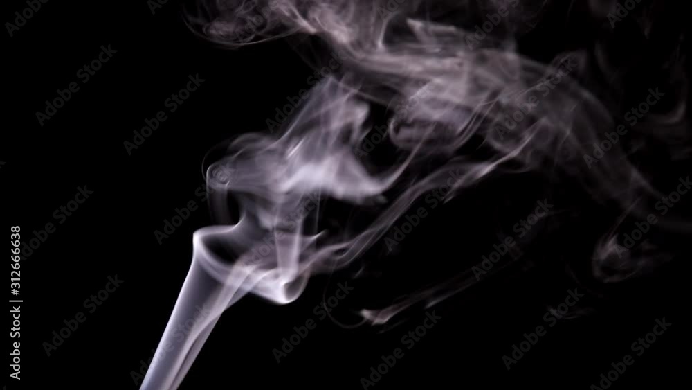 The wisps of smoke from the incense stick slowly rise up and curl with bizarre curls in rare tremors of air. The wisps of smoke from the incense stick slowly rise up and curl with bizarre curls in rare tremors of air.
