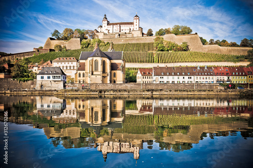 Wurzburg. Main river waterfront and scenic Wurzburg castle and vineyards reflection view