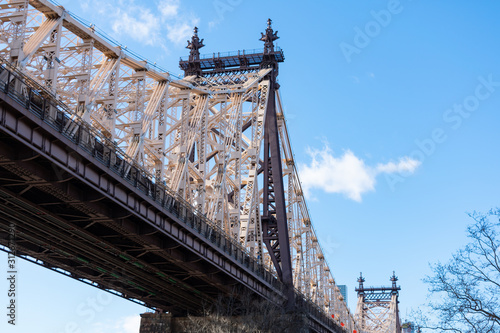 Looking Up at the Queensboro Bridge and a Blue Sky in New York City
