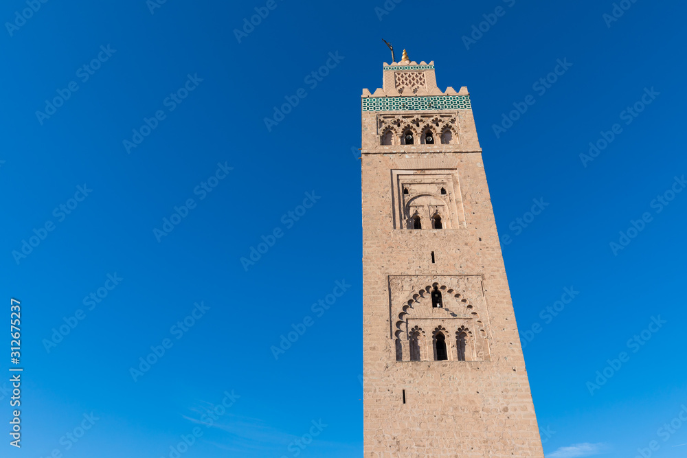 Koutoubia Mosque is the largest mosque in Marrakech, Morocco. It is also known by several other names, such as Jami ‘al-Kutubiyya, Koutoubia, Kutubiya, Kutubiyya and the Booksellers’ Mosque. Sunny day
