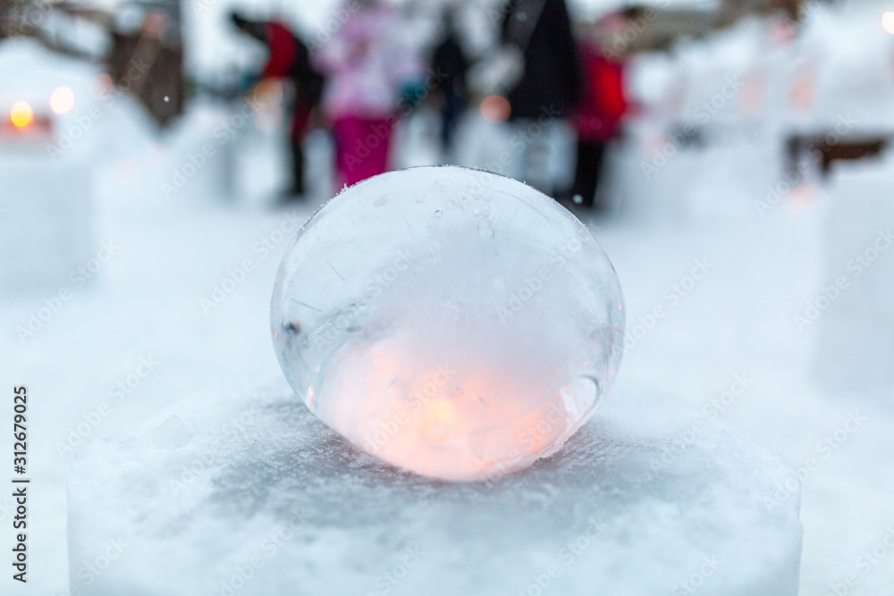 Ice lantern with candle burning inside Ice lantern with candle burning inside