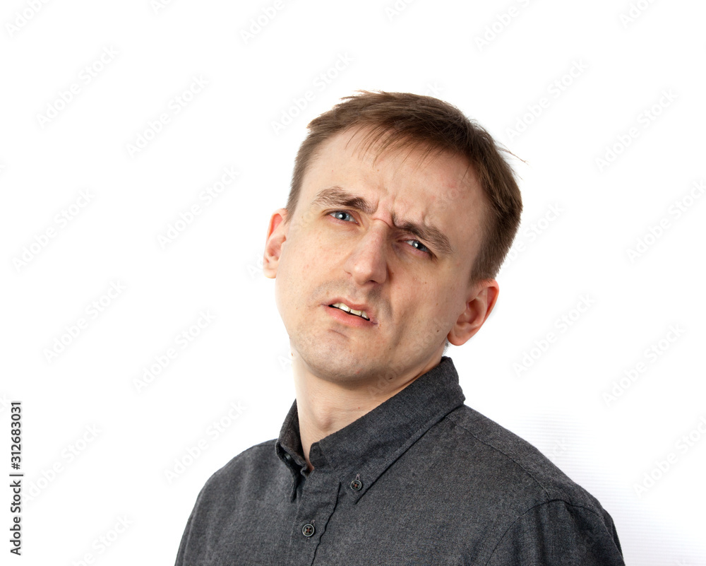 Fototapeta premium Young male portrait listening carefully to something