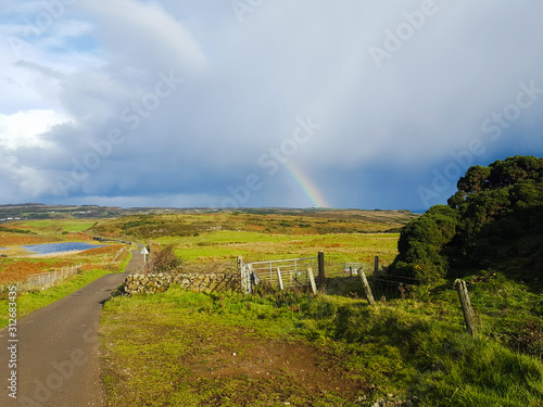 Colorful autumn  landscape with rainbow on island Rathlin, Northern Ireland  photo