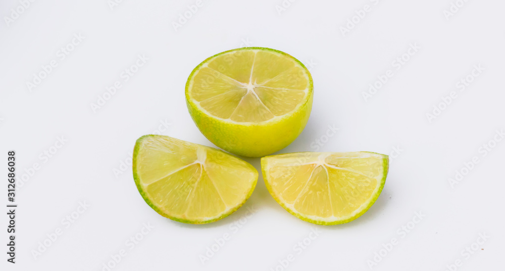 close up of slices of a green lemon close up of slices of a green lemon