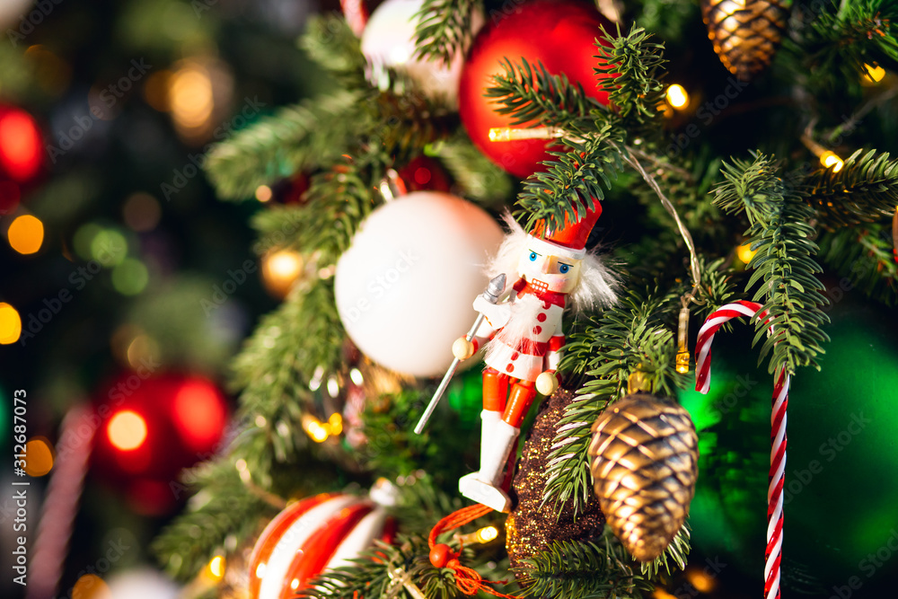 Obraz premium Decorated European American Christmas tree red and green color, close-up of toys and decor striped candy