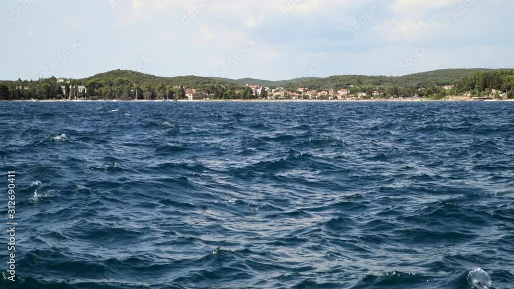 The view of blue sea with sailing boat The view of blue sea with sailing boat