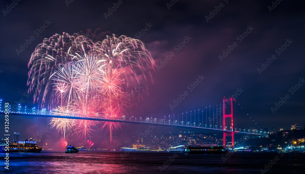 Obraz premium ISTANBUL, TURKEY. New Year 2020 Celebrations Around the Istanbul. Fireworks with Istanbul Bosphorus Bridge (15th July Martyrs Bridge). .
