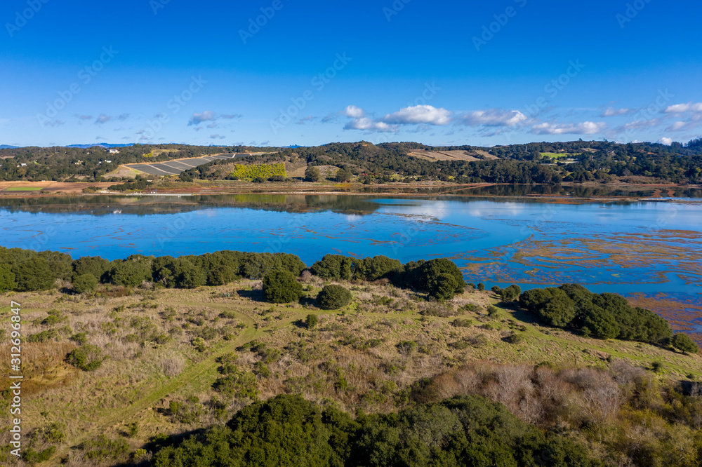 Aerial View of Elkhorn Slough, Moss Landing, California. Elkhorn Slough is a 7-mile-long tidal slough and estuary on Monterey Bay in Monterey County, California. Hiking, bird watching, kayaking. 