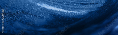 Beautiful abstract bright dark blue background with streaks and stains. Banner format