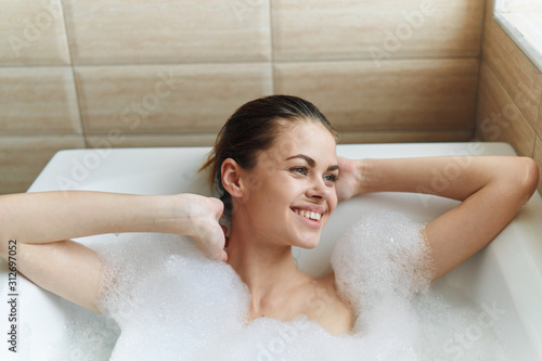 young woman in bubble bath