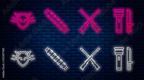 Set line Hunting cartridge belt with cartridges, Two crossed shotguns, Deer antlers on shield and Flashlight and knife. Glowing neon icon on brick wall. Vector