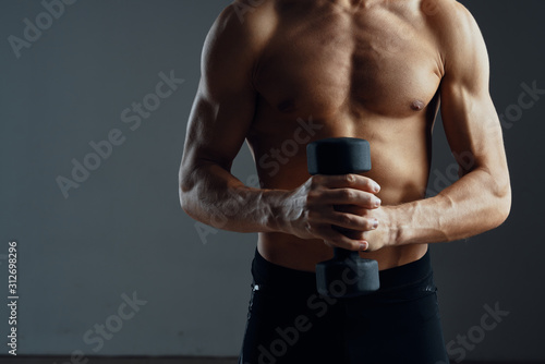muscular man lifting weights © SHOTPRIME STUDIO