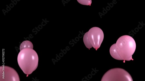Festive pink balloons fall on a black background. Slow motion. FHD