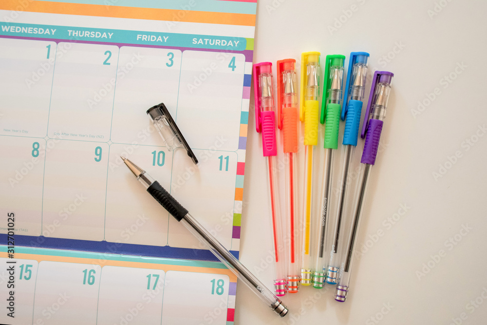 Calendar for planning and ideas writing with rainbow pens on the side Calendar for planning and ideas writing with rainbow pens on the side