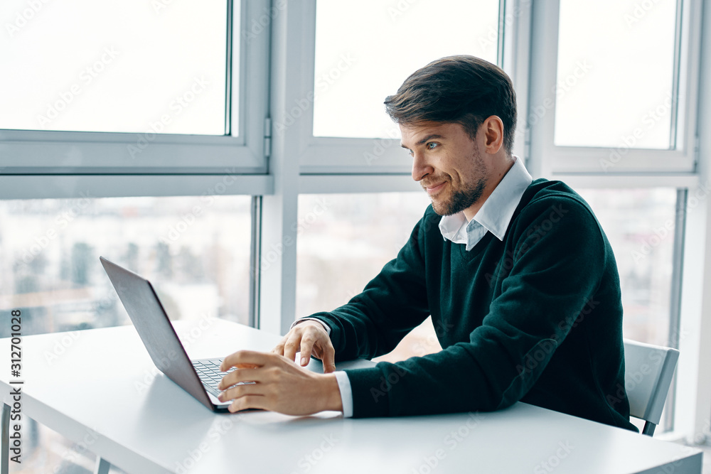 businessman working on laptop in office businessman working on laptop in office