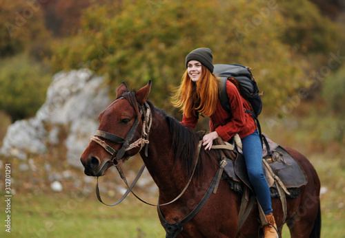 young woman riding horse