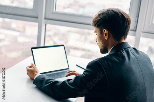 young man with laptop © SHOTPRIME STUDIO