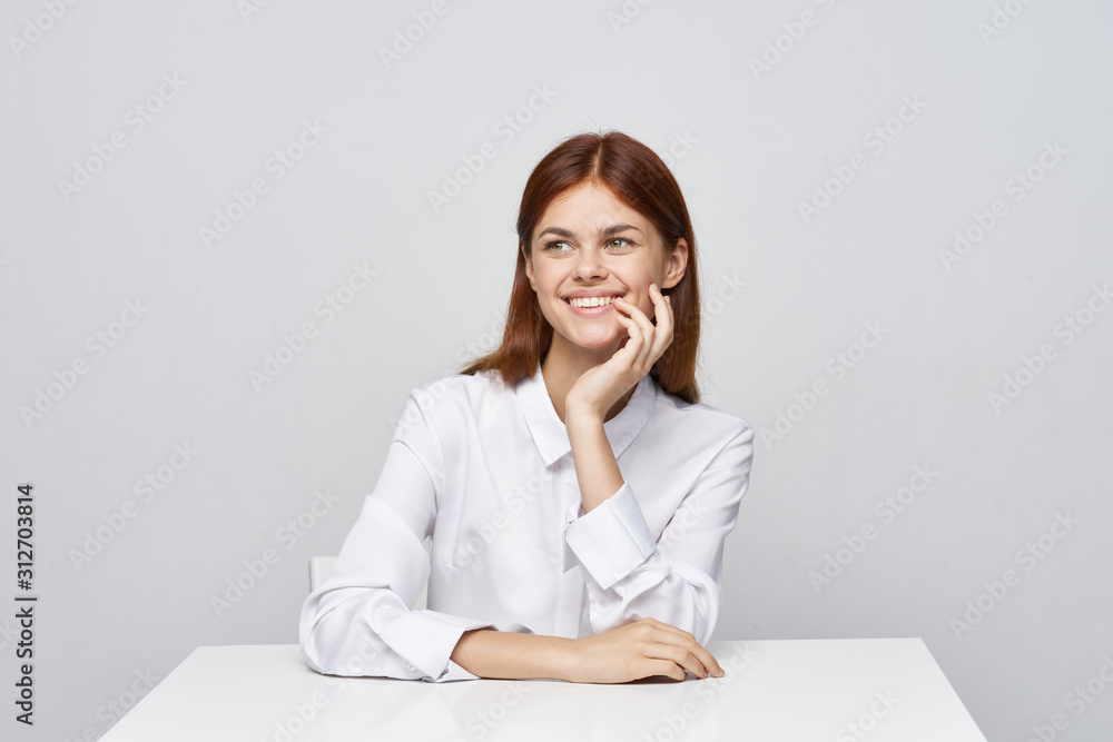 portrait of a businesswoman sitting at her desk portrait of a businesswoman sitting at her desk