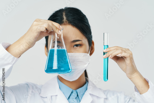 Fototapeta Naklejka Na Ścianę i Meble -  scientist in laboratory with test tubes