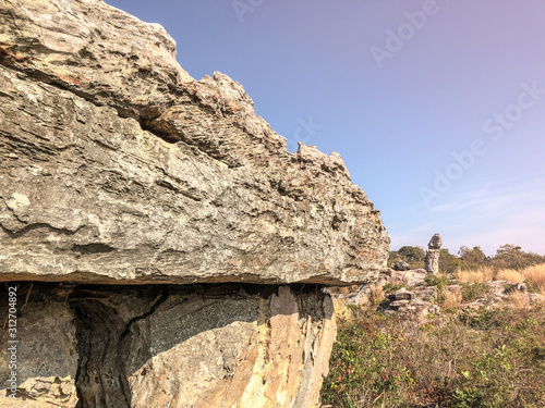 Blank space cliff edge with mountain on clouds blue sky photo