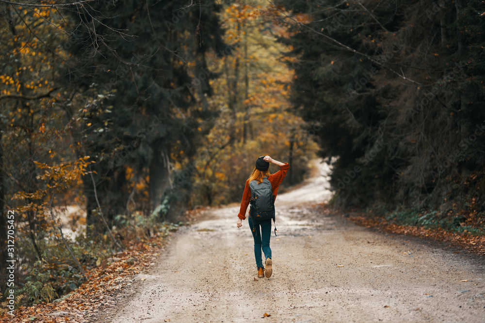 Obraz premium young woman riding a bike in the forest