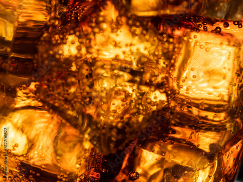 Cola With Ice And Bubbles In The Glass background