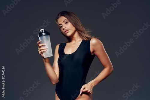 young woman with bottle of water © SHOTPRIME STUDIO