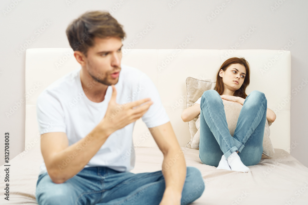 couple sitting on sofa and watching tv couple sitting on sofa and watching tv