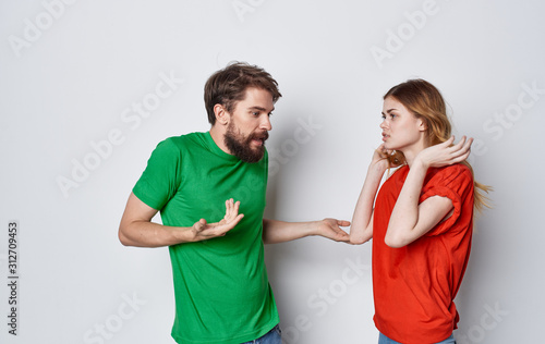 young couple in t-shirts chatting