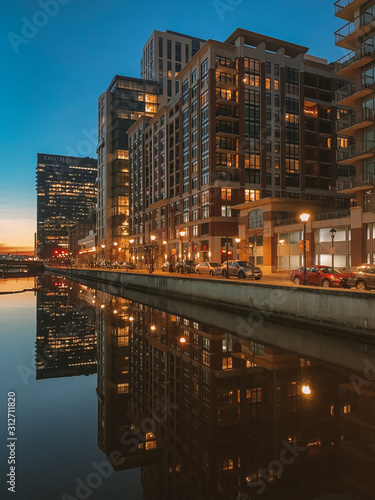 Cityscape view of Harbor East at night, in Baltimore, Maryland