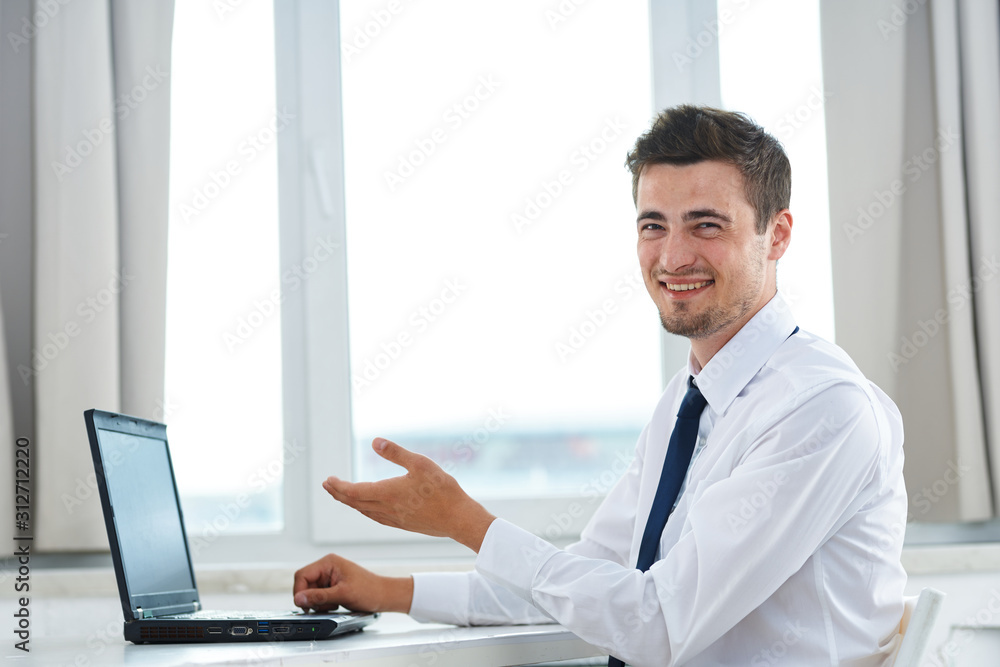 portrait of a businessman working on his laptop portrait of a businessman working on his laptop