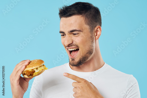 man with hamburger on white background