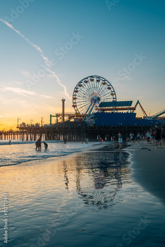 The Santa Monica Pier at sunset, in Los Angeles, California photo