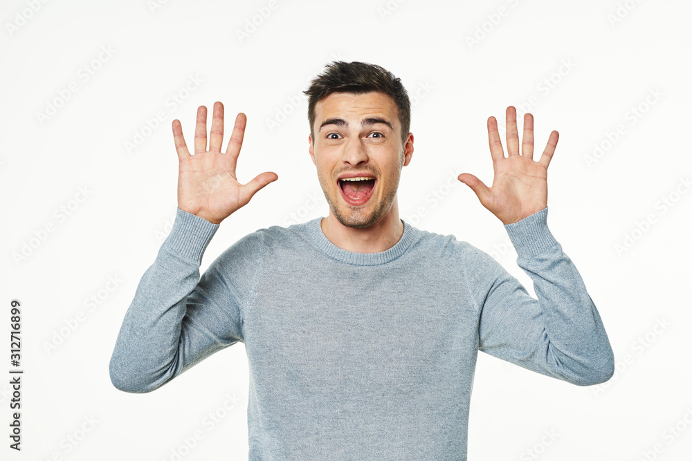young man with hands up young man with hands up