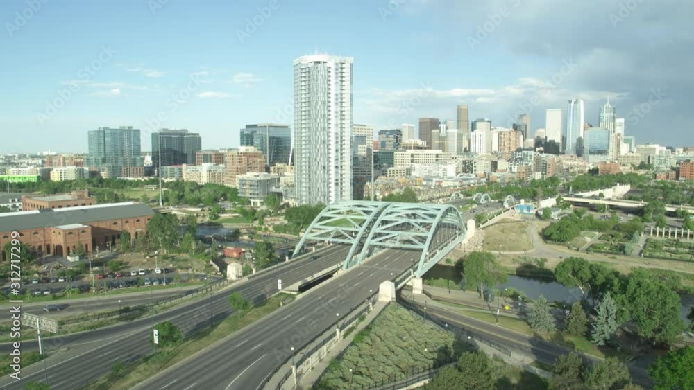 Denver skyline aerial daytime bridge panning right around highway Inspire 2 ProRes 422 HQ sunny day Mountain backdrop Denver skyline aerial daytime bridge panning right around highway Inspire 2 ProRes 422 HQ sunny day Mountain backdrop