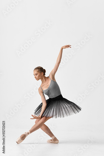 ballet dancer posing isolated on white background