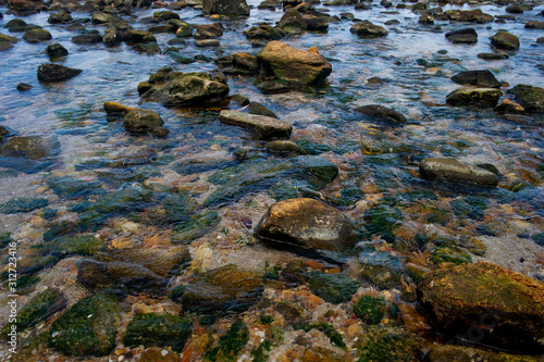 Beautiful seaside boulders and bright sea water © FOTO SALE