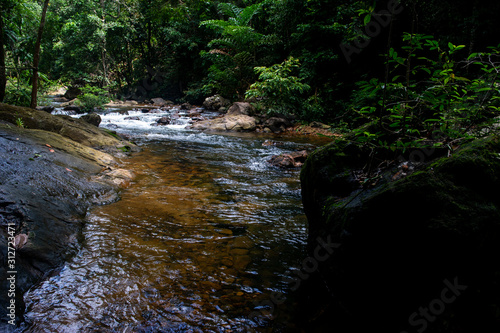 Natural waterfall  shoulder river  through the top of the mountain