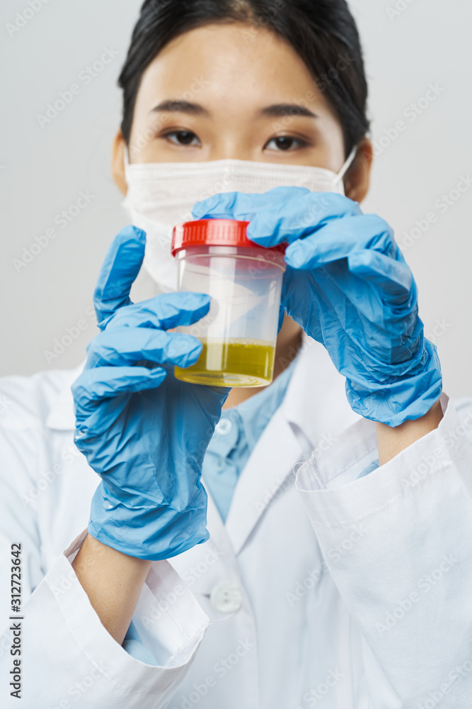 Fototapeta premium scientist in laboratory with test tubes