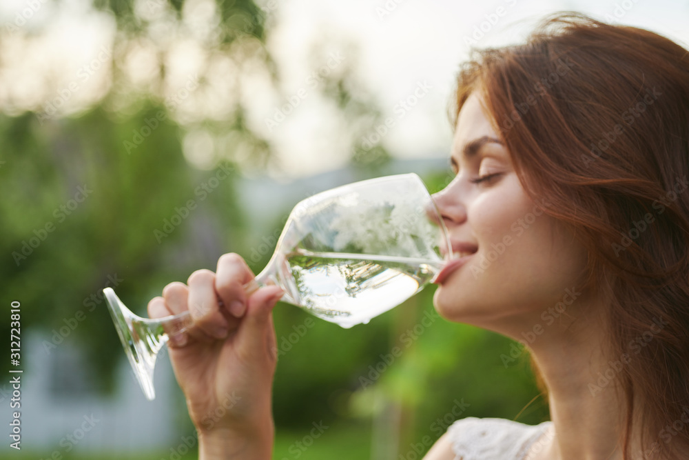 young woman drinking water from a bottle young woman drinking water from a bottle