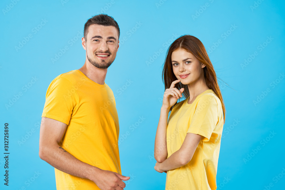 young couple in t-shirts chatting young couple in t-shirts chatting