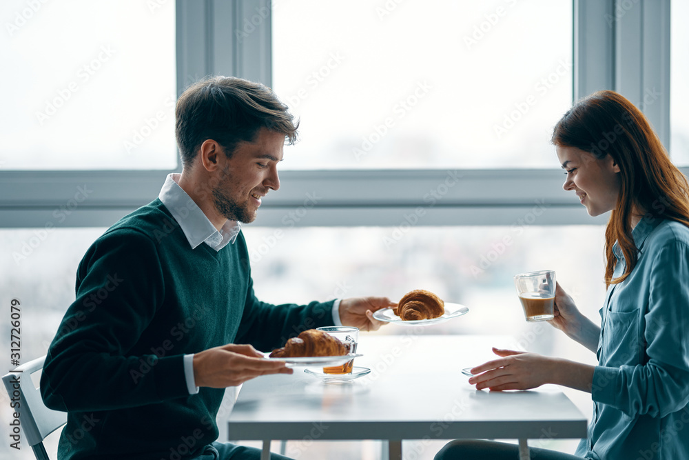 young couple having dinner in restaurant young couple having dinner in restaurant