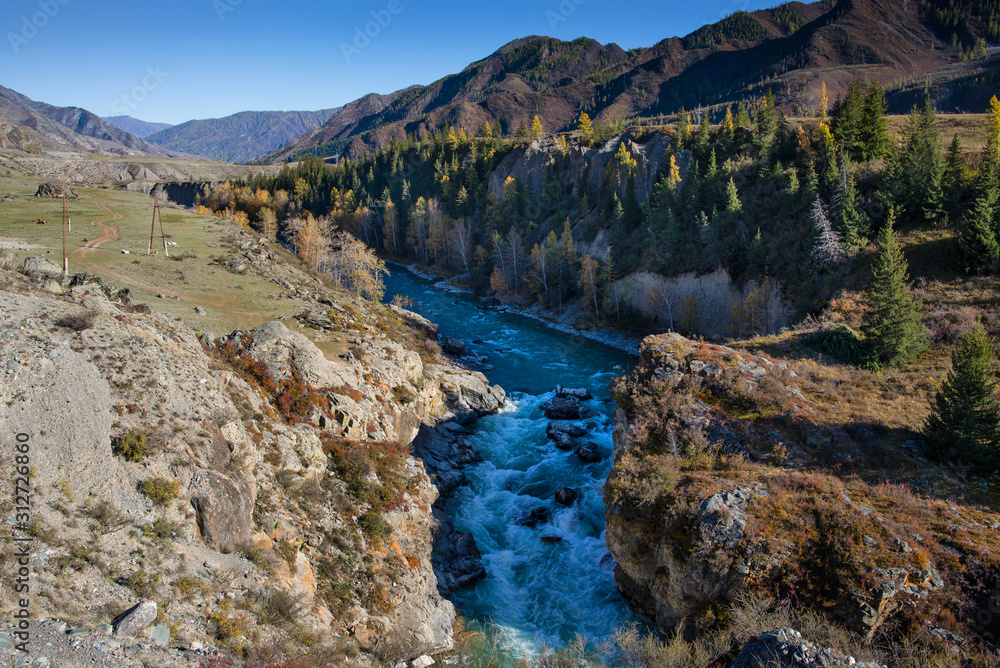 Beautiful Chuya River Valley is the Republic of Altai Russia. A mountain road along the Chuya River.