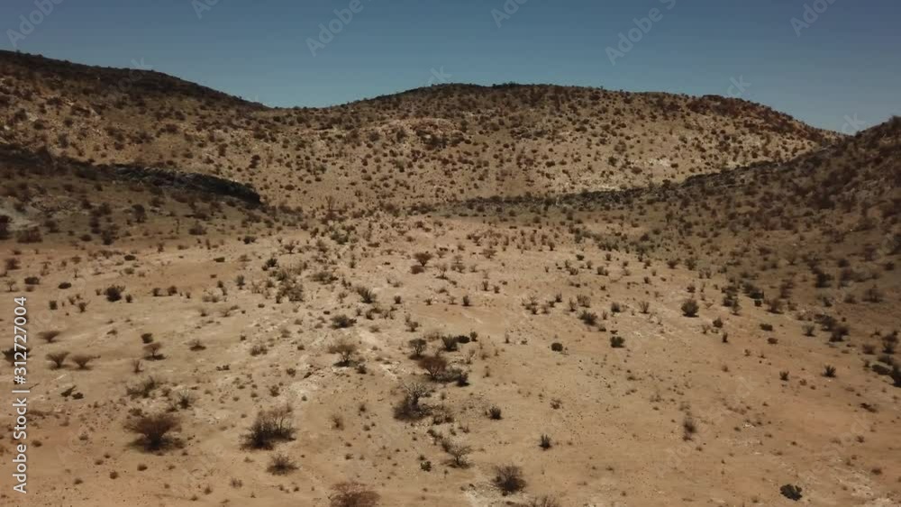 4K aerial drone video of gravel plains and Erongo Mountains near town Usakos, B1 highway to west coast of Namibia and dry waterless hot bushy savanna in Karibib District, central Namibia 4K aerial drone video of gravel plains and Erongo Mountains near town Usakos, B1 highway to west coast of Namibia and dry waterless hot bushy savanna in Karibib District, central Namibia