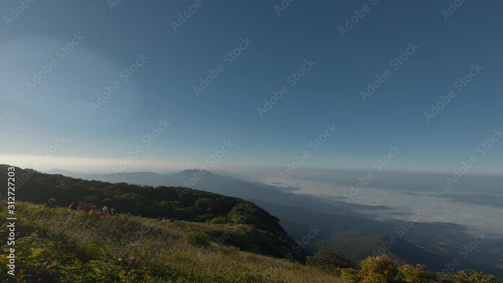 People walking by trail on mountain top early morning. Doi Inthanon mountain Thailand People walking by trail on mountain top early morning. Doi Inthanon mountain Thailand