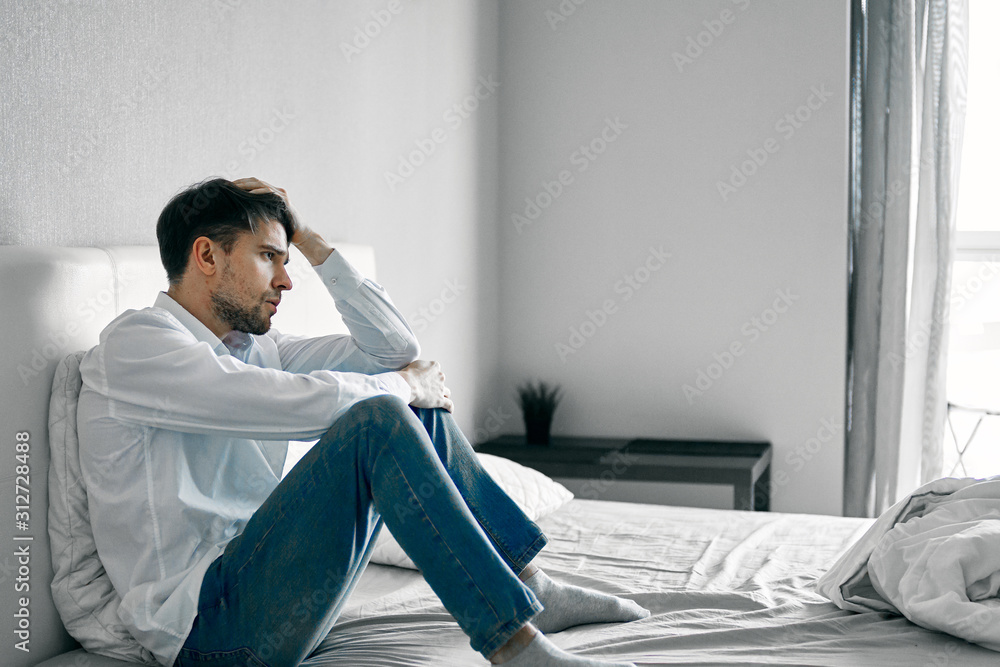 man sitting on sofa with laptop man sitting on sofa with laptop
