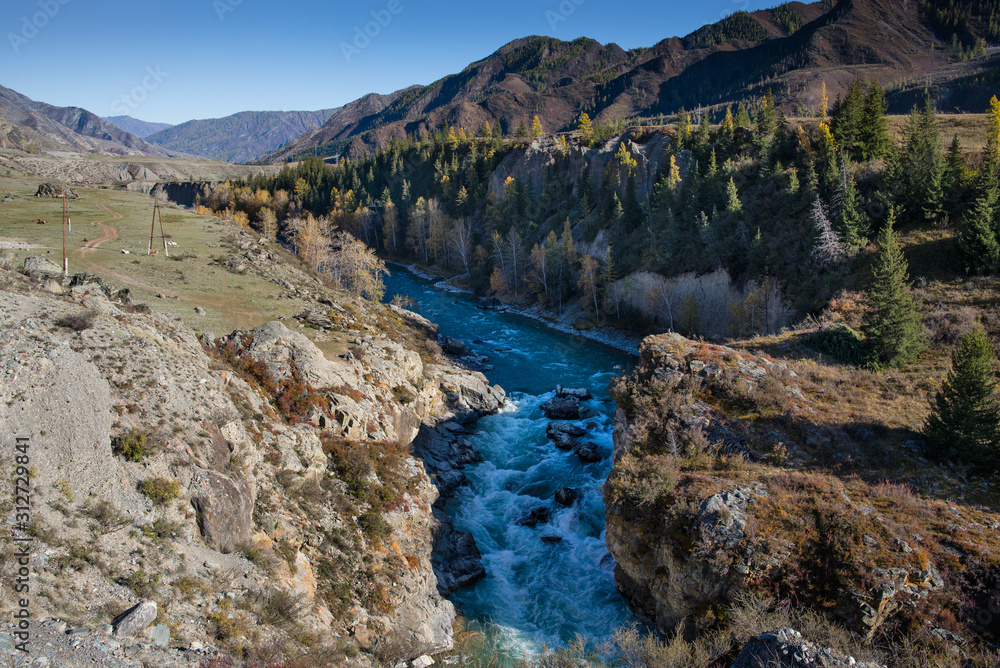 Beautiful Chuya River Valley is the Republic of Altai Russia. A mountain road along the Chuya River.