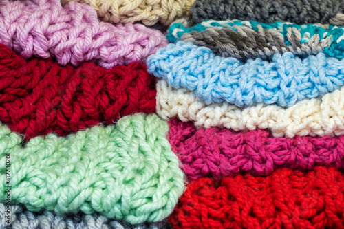 Colorful multicolored wool knitted fabric closeup.