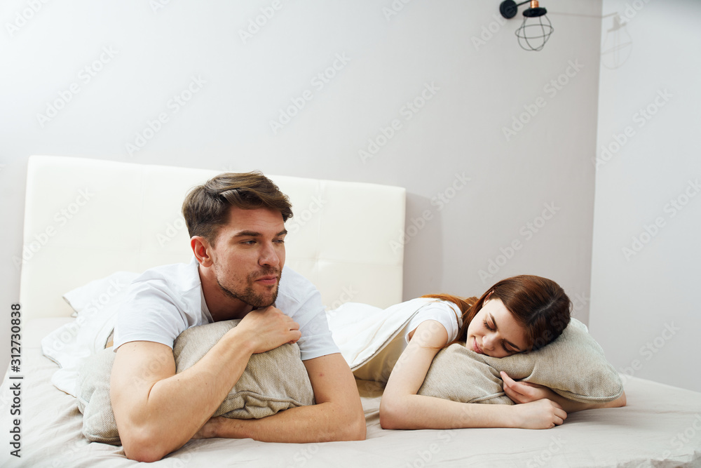 couple lying on bed couple lying on bed